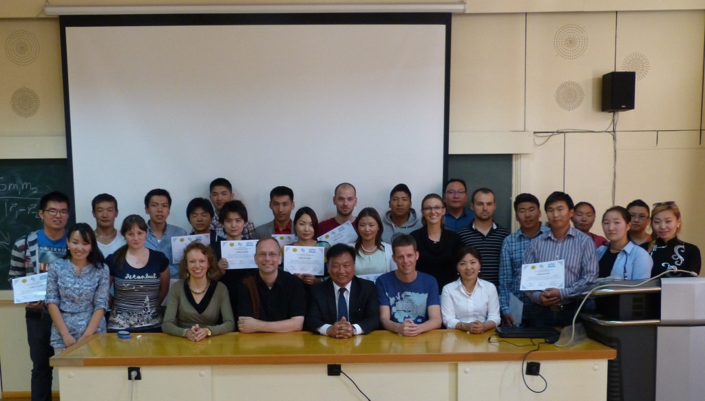 Teachers and participants at the school, after the students received their certificates of achievement and attendance